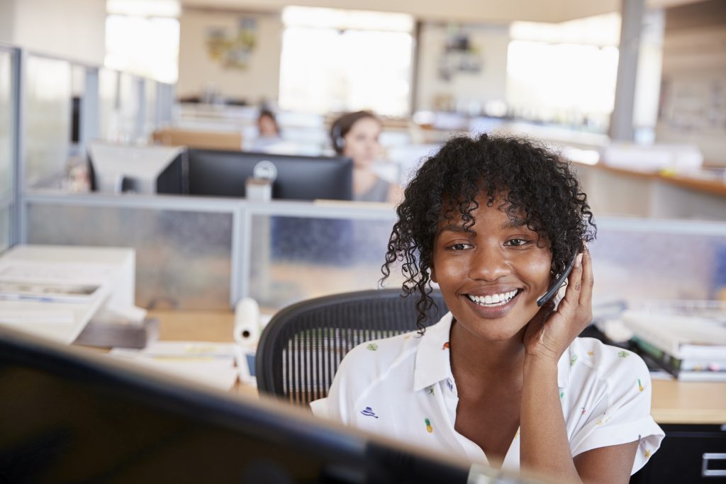 young black woman working in a call centre R3WZSQK